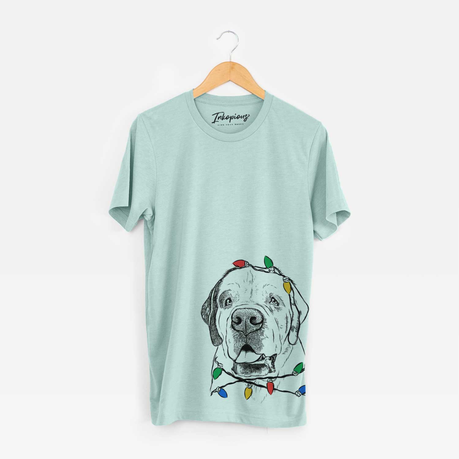 Hand-drawn sketch of Wendy the Saint Bernard wrapped in Christmas lights on a Heather Sage Unisex crewneck