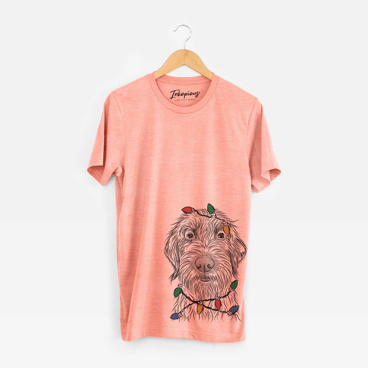 Hand-drawn sketch of Wilkins the Wirehaired Pointing Griffon wrapped in Christmas lights on a Sunset Unisex crewneck