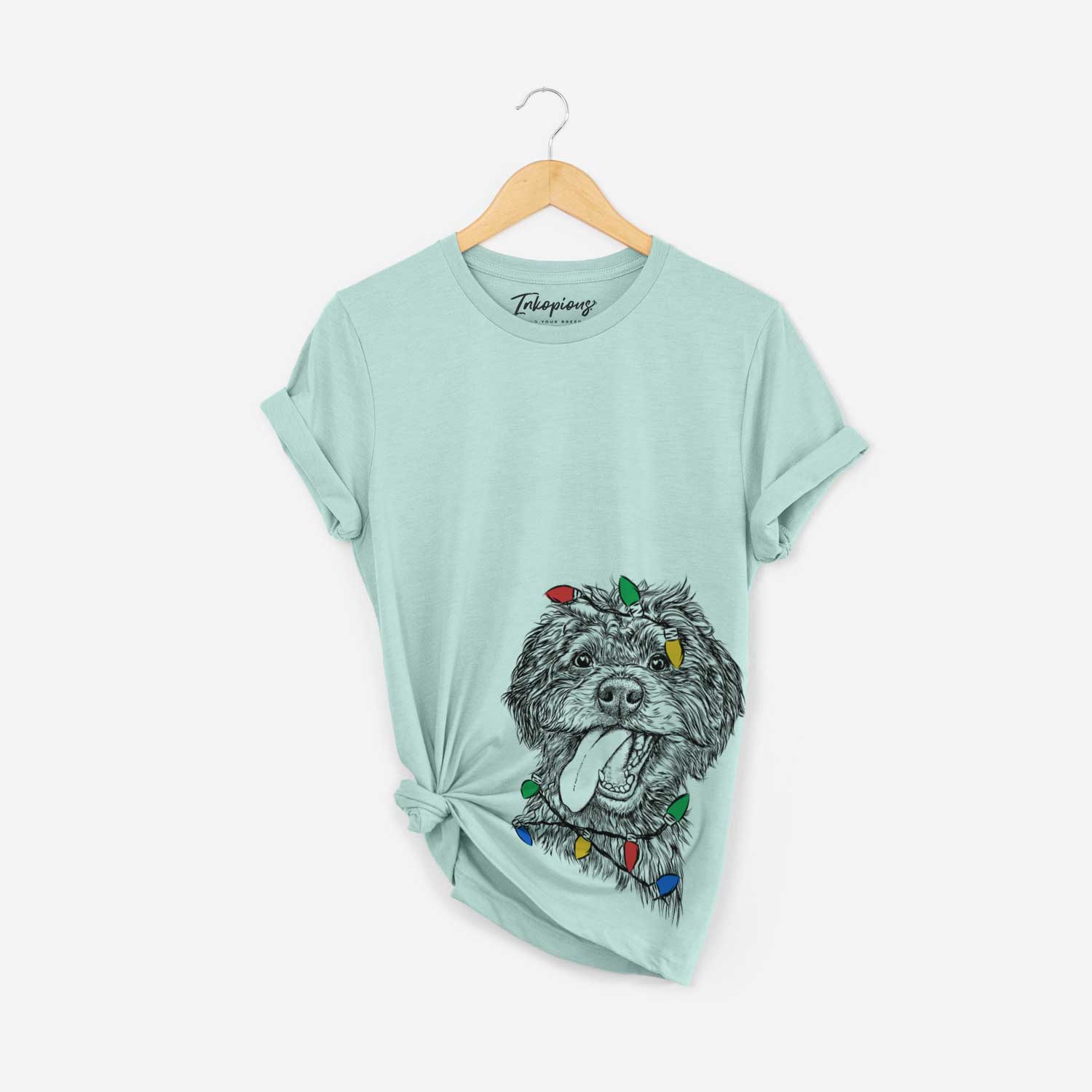 Hand-drawn sketch of Winnie the Mini Aussiedoodle wrapped in Christmas lights on a Heather Sage Unisex crewneck