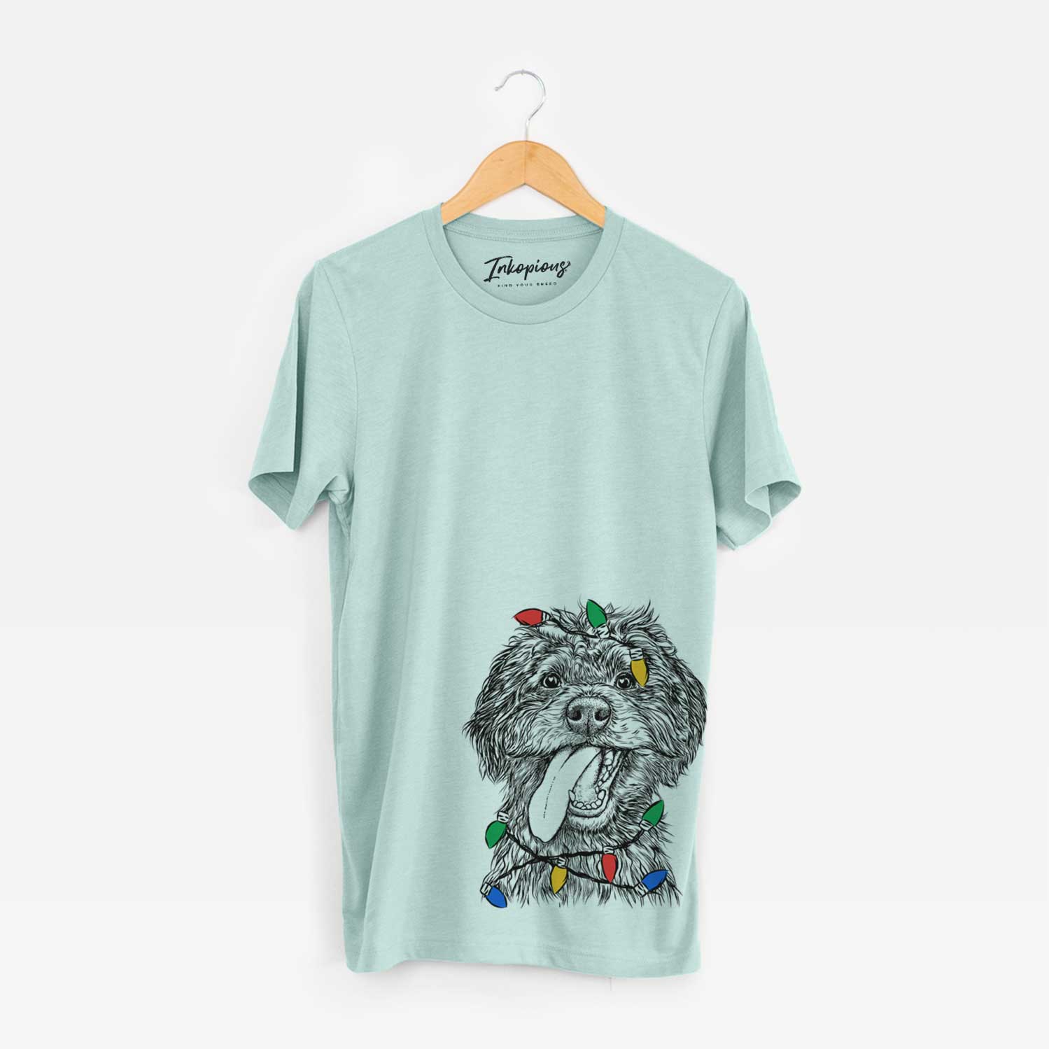 Hand-drawn sketch of Winnie the Mini Aussiedoodle wrapped in Christmas lights on a Heather Sage Unisex crewneck
