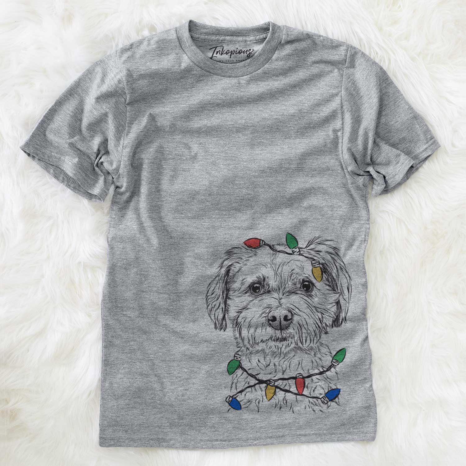 Hand-drawn sketch of Wyatt the Coton de Tulear wrapped in Christmas lights on a Grey Unisex crewneck