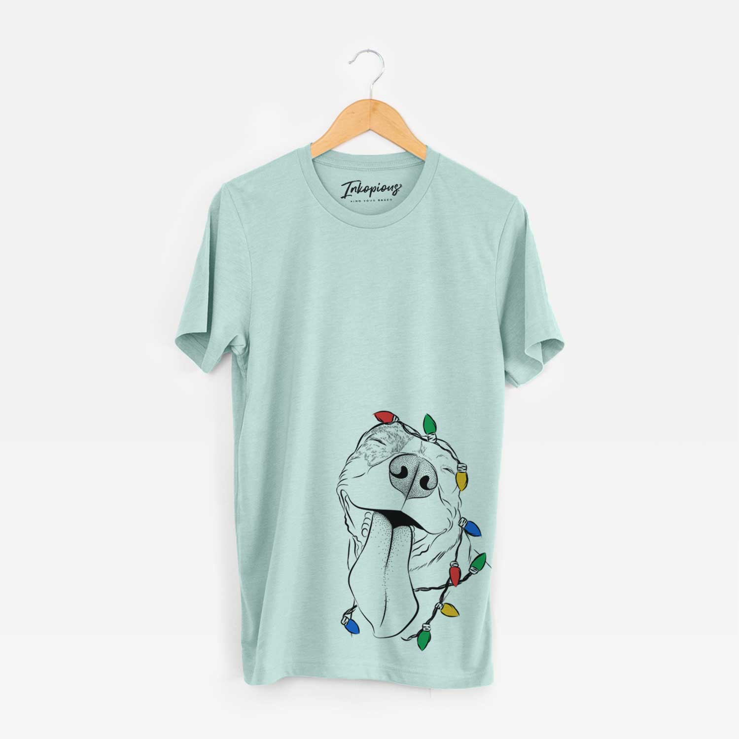 Hand-drawn sketch of Xena the American Staffordshire Terrier wrapped in Christmas lights on a Heather Sage Unisex crewneck