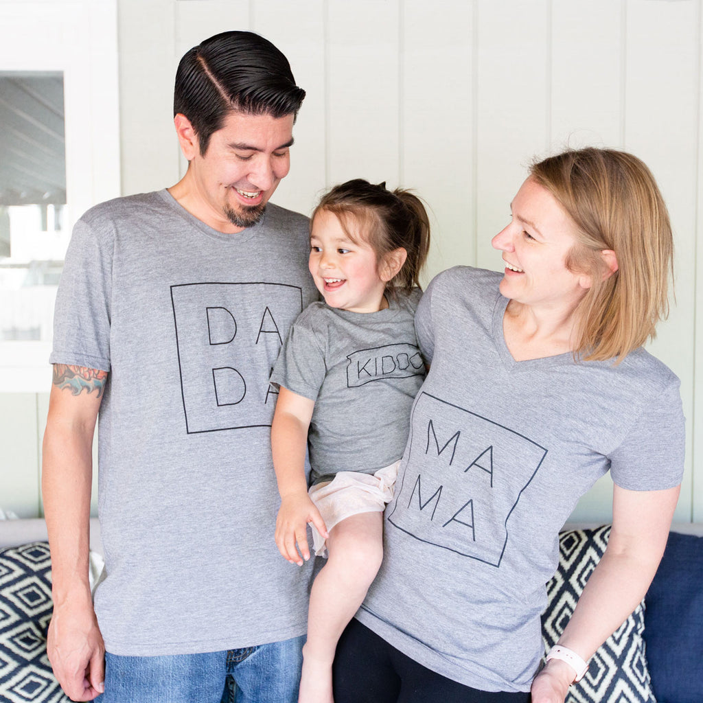 our happy family wearing shirts with dadda, mama, and kiddo