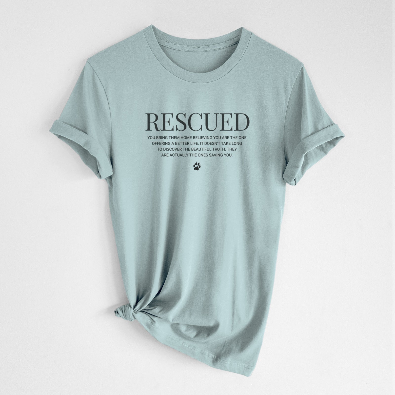 'Rescued - They're the Ones Saving You' design on a Dusty Blue Unisex crewneck, worn by a woman